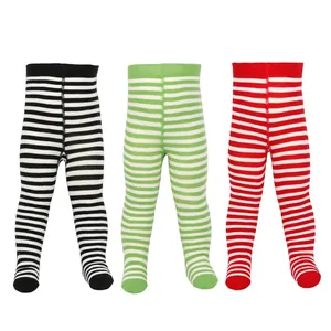 Detailed view of three pairs of striped footed infant leggings in black, green, and red.