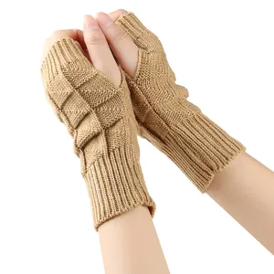 Detailed view of camel fingerless knit gloves showing the textured cable stitch pattern
