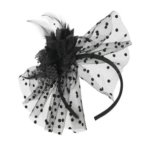 Detail view of black fascinator headband with feathers and polka dot mesh veil
