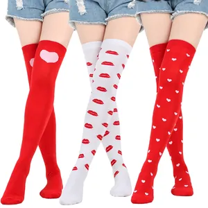 Detailed view of Valentine's Day over-the-knee socks with red heart and lip print patterns