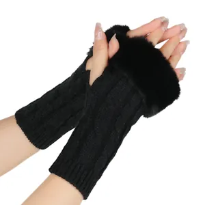Close-up of black cable knit fingerless gloves with soft faux fur trim for winter