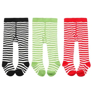 Set of three striped baby footed tights in black, green, and red holiday patterns