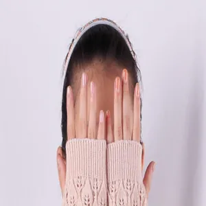Detailed view of pink hollow knit fingerless gloves with elegant leaf lace patterns