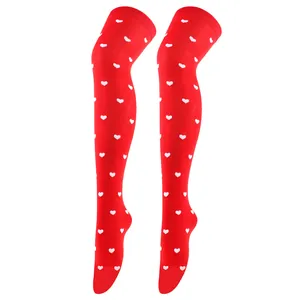 Full detail view of red thigh-high stockings with white heart patterns on white background