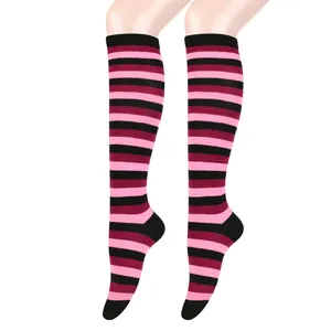 Close-up detail showing the texture and pattern of black and pink striped knee-high socks