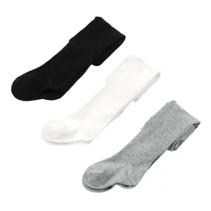 Detailed view of three pairs of toddler footed tights in black, white, and grey colors
