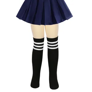 Black children's over-the-knee socks with white stripes on mannequin