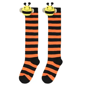Cute children's bee doll knee-high socks with orange and black stripes.