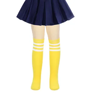 Detailed view of kids yellow over-the-knee socks featuring three classic white stripes