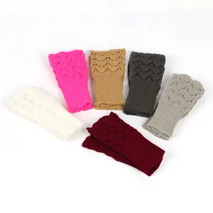 Collection of knitted fingerless gloves with heart patterns in various winter colors
