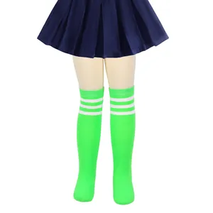 Close-up detail of girls bright green knit knee high socks with three white stripes
