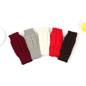 Detailed view of colorful knitted fingerless arm warmers with textured cable patterns
