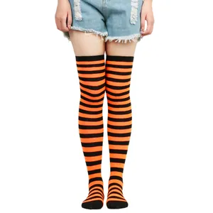 Full view of striped over-the-knee socks in orange and black for Halloween cosplay