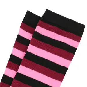 Close-up detail of black pink and burgundy striped knee-high socks for cosplay costumes