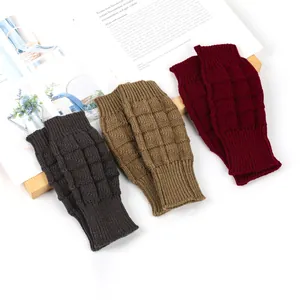 Detailed view of knitted fingerless gloves in brown, khaki, and burgundy colors