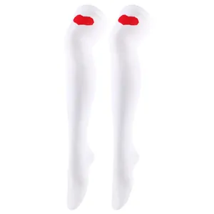 Macro detail of white over-the-knee stockings featuring a red knitted heart motif.