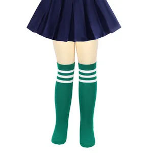 Detail view of green knitted knee high socks with three white stripes for children