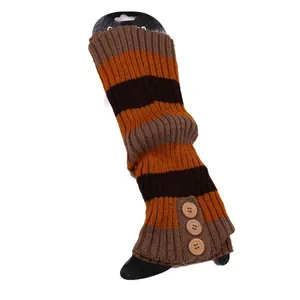 Detailed view of striped knitted leg warmers featuring three decorative wooden buttons.