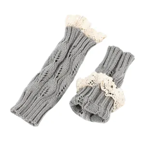 Stylish grey knitted fingerless gloves with elegant white lace trim and hollow leaf pattern
