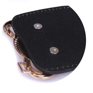 Macro detail of black elastic wide waist belt featuring golden metal buckle hardware