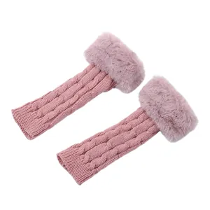 Pink cable knit fingerless gloves with luxurious faux fur trim detail.