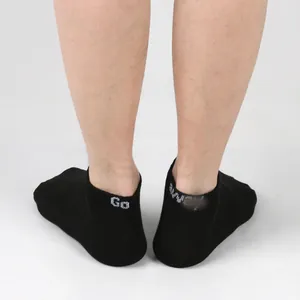 Rear view detail of black men's ankle socks with white 'Go away' slogan print