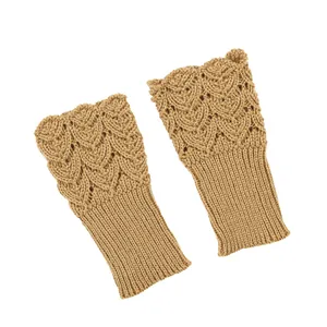 Detail showing the intricate hollow heart knitted pattern on camel fingerless arm warmers
