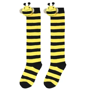 Knee-high yellow and black striped socks with cute plush bee dolls for children