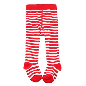 Close-up detail of infant red and white striped footed tights for holiday wear