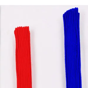Close-up detail view of vertical ribbed knitted acrylic arm warmers in red and blue