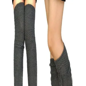 Close-up detail of grey knitted over-the-knee leg warmers for yoga and ballet dance wear