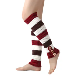 Close-up of striped knitted leg warmers with vintage button details in red and brown.
