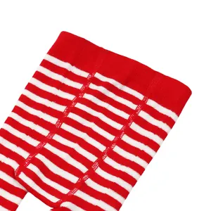 Close-up view of red and white striped infant footed tights showing soft fabric texture.