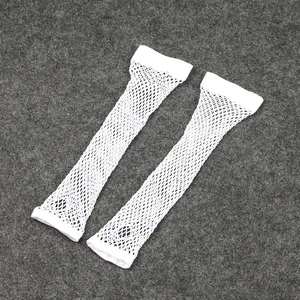 Macro detail of white fine fishnet elastic long gloves with hollow design for party