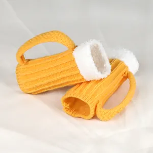 Detailed view of the beer mug knitted gloves featuring fuzzy white rim and yellow ribs.
