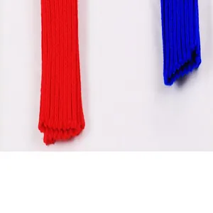 Detailed close-up showing the ribbed knit texture of red and blue winter arm warmers