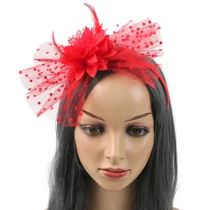 Vintage red fascinator headband with feather flower and mesh veil for bridal weddings
