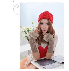 Detailed view of long knitted fingerless arm warmers with brown faux fur trim for women