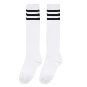 Classic white children's knee-high socks with three black athletic stripes detail.