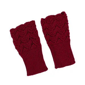 High-quality detailed macro view of burgundy knit fingerless gloves with heart pattern texture