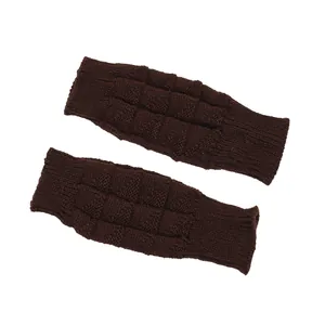 Detailed view of dark brown knitted fingerless gloves with waffle texture design.
