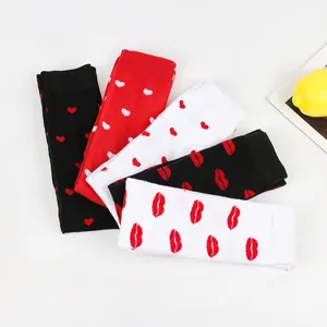 Detailed view of Valentine's Day high socks with heart and lip patterns in various colors