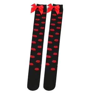 Black over-the-knee socks featuring red lips pattern and decorative bows at the top.