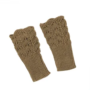 Close-up view of khaki knitted fingerless gloves featuring hollow heart patterns