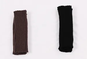 Ribbed knit fingerless arm warmers in dark brown and black shown on a white background.