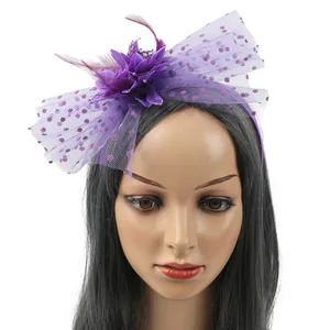 Purple vintage fascinator headband with feathers and polka-dot mesh for weddings