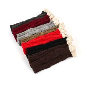 Display of various colored knit fingerless gloves featuring lace trim and leaf pattern details