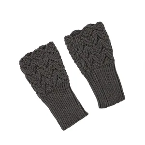 Close-up detail of dark grey cable knit arm warmers featuring a hollow heart pattern