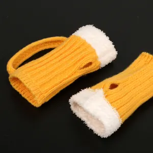 Close-up of creative beer mug shaped half finger winter knitted gloves with plush foam top