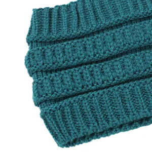 Macro view showing the soft teal ribbed knit texture of a cozy winter headband